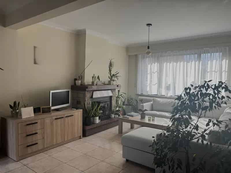 Rijwoning met 2 à 3 slaapkamers en tuin
