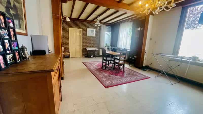 Ruime rijwoning met atelier en 2 garages in het hart van Ruddervoorde