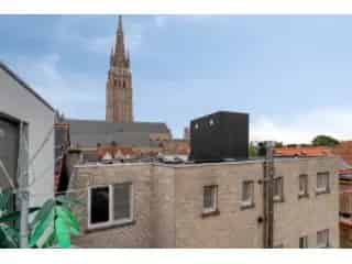 Appartement Brugge: Luxe, Panoramisch Uitzicht & Hallentoren