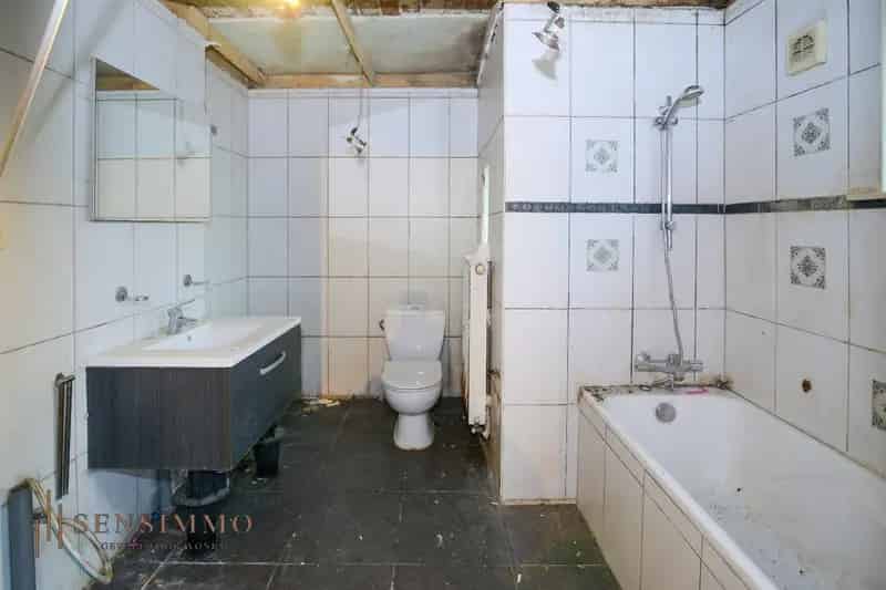 Te renoveren halfopen Tuinwijkwoning met 3 slaapkamers te Genk