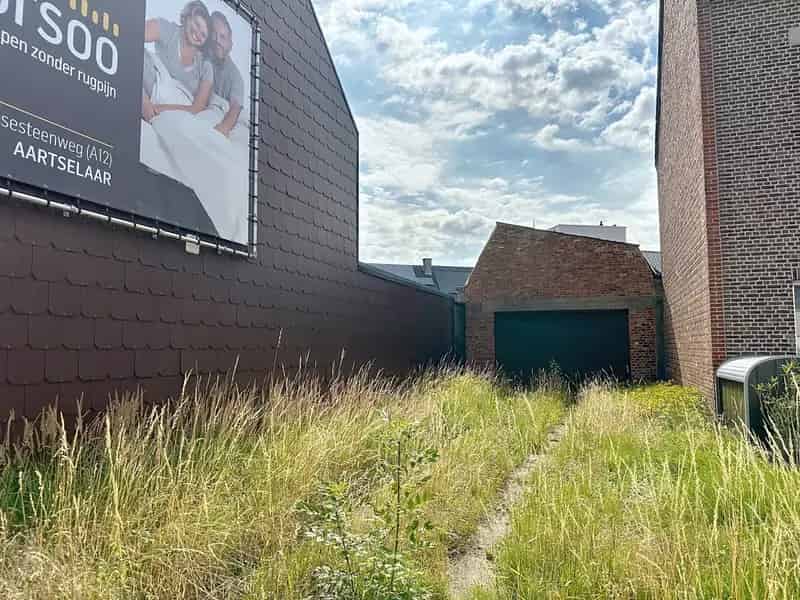 Bouwgrond met af te breken magazijn in centrum Schelle – mogelijk 6% btw op nieuwbouw!