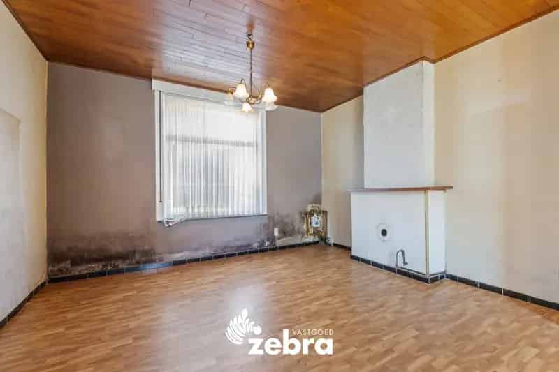 Te renoveren woning met stadskoer in centrum Tielt!