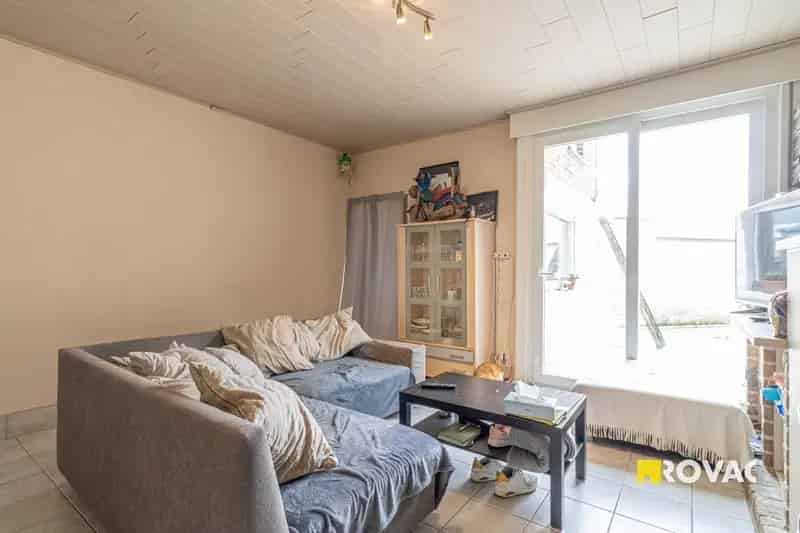 Rijwoning met 2 slaapkamers (mogelijks 3) en koer