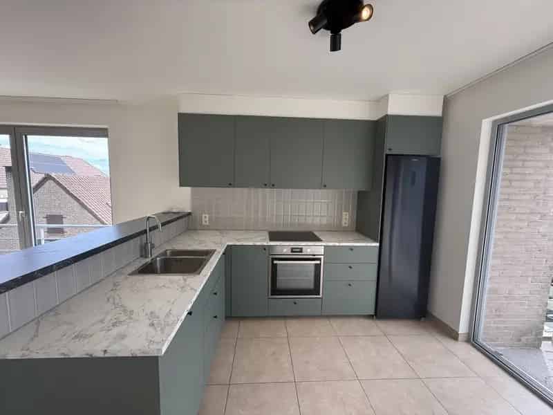 HAALTERT - Ruim appartement mét garage vlakbij de dorpskern.