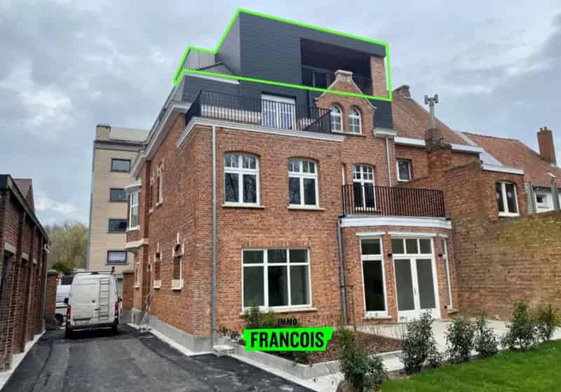 Modern eenslaapkamerappartement met lift, terras en gemeenschappelijke tuin in Ieper