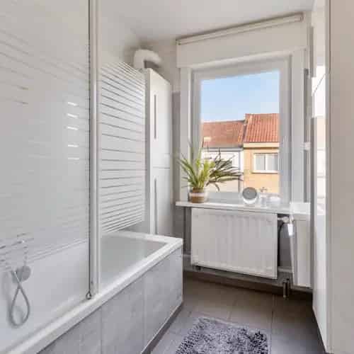 Charmante rijwoning met 5 slaapkamers en tuin in hartje De Panne