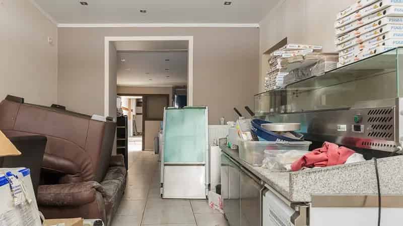 Handelszaak met duplex appartement in centrum Tienen