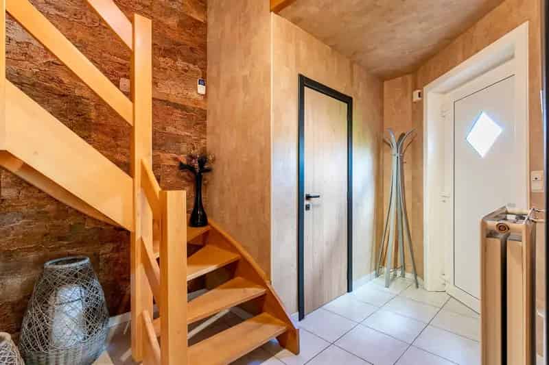 Rustig gelegen, energiezuinige woning op +/- 7a te Buizingen.