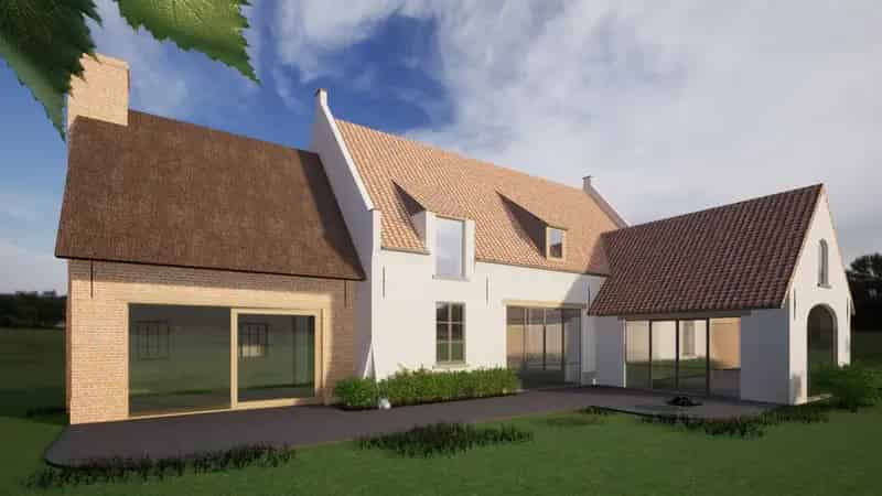Bouwgrond omringd door groene velden
