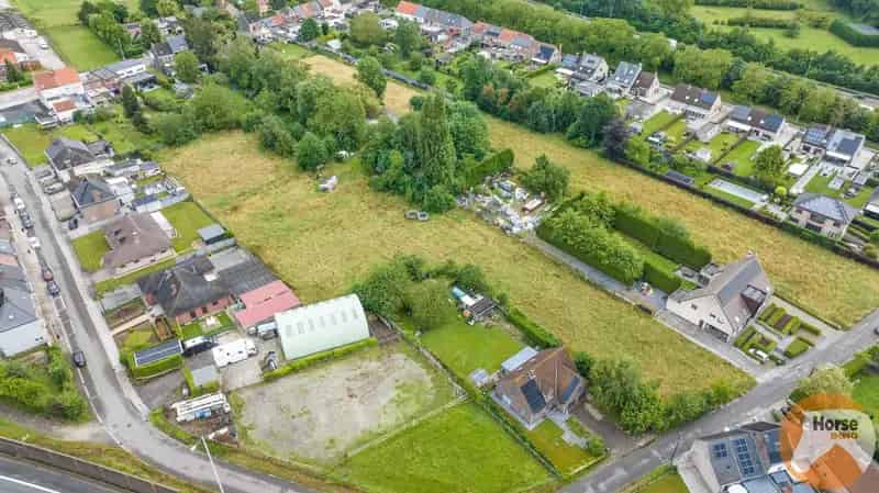 NIEUWERKERKEN - Bouwgrond voor HOB met weide op +/-50are